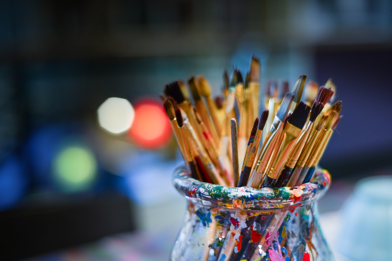 close up of paintbrushes in jar