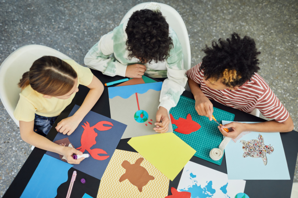 Kids crafting with construction paper