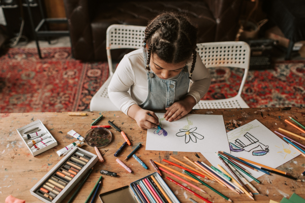 Kid drawing on paper