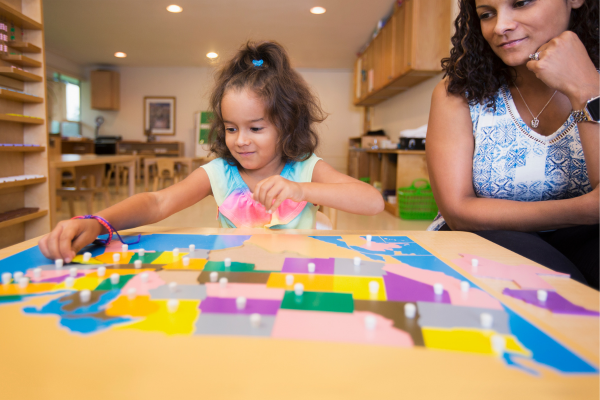 kid playing with Montessori toy